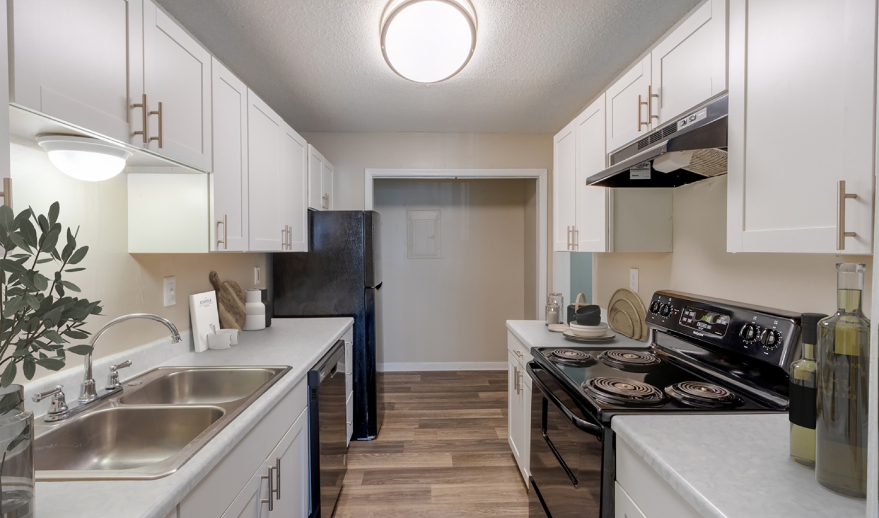 kitchen with white cabinets and black appliances