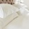 a close up of pillows on a bed