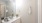 bathroom sink with mirror and ample lighting
