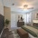 spacious bedroom with ceiling fan and light fixture
