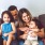 a family sitting on a couch